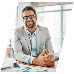 Man sitting in an office smiling